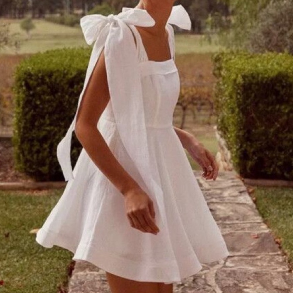 DISSH Aisle white bow mini dress